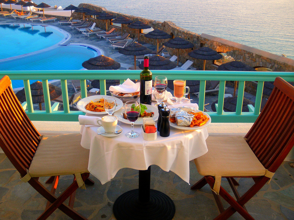 Our Dinner for two with pool and sea views at our balcony in the Royal Myconian Hotel in Elia Beach, Mykonos