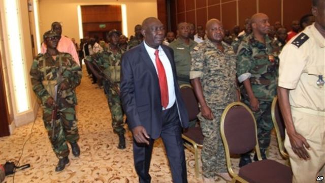 Michel Djotodia, center, rebel leader who declared himself president, arrives for meetings with government armed forces, Bangui, Central African Republic, March 28, 2013.