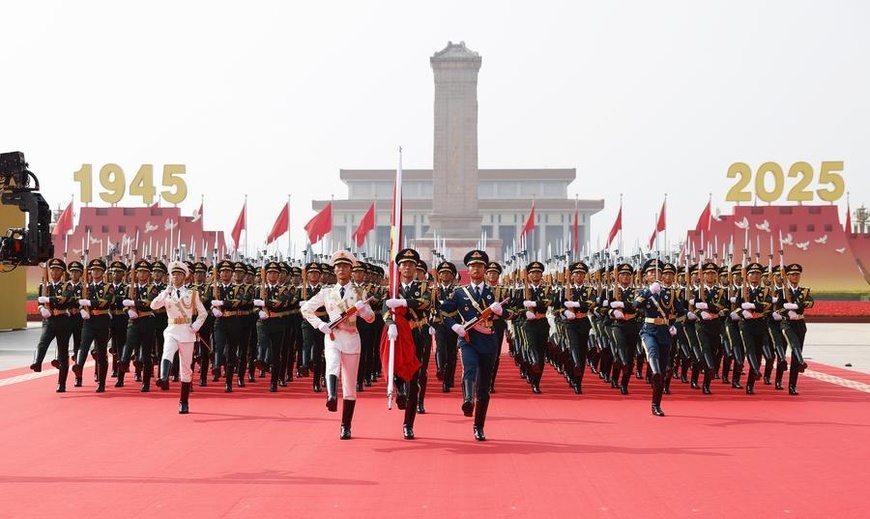 Honor guard escort the Chinese national flag for a flag-raising ceremony during a grand gathering to commemorate the 80th anniversary of the victory in the Chinese People's War of Resistance against Japanese Aggression and the World Anti-Fascist War in Beijing, capital of China, Sept. 3, 2025. (Xinhua/Fei Maohua)