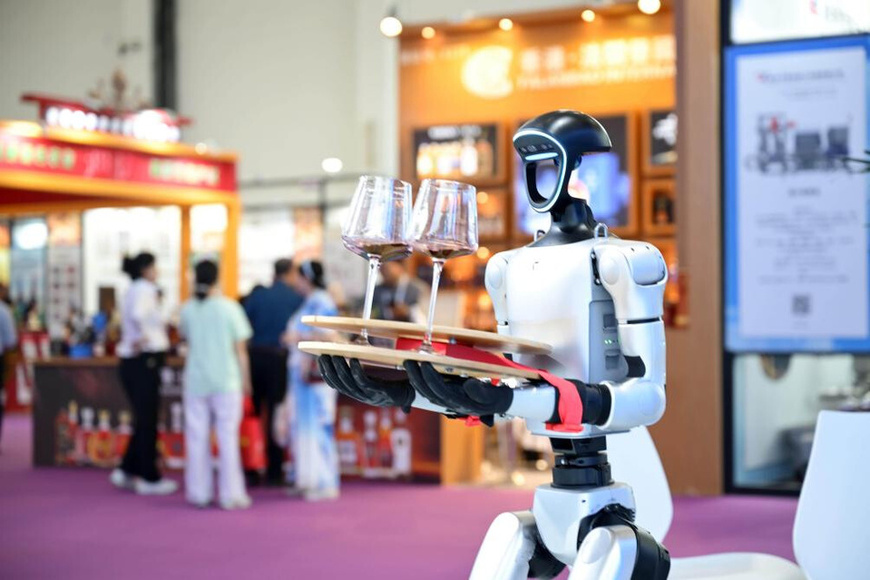 A robot developed by Chinese tech firm Unitree Robotics serves visitors at the Fifth China (Ningxia) International Wine Culture and Tourism Expo, June 10, 2025. (Photo/Yuan Hongyan)