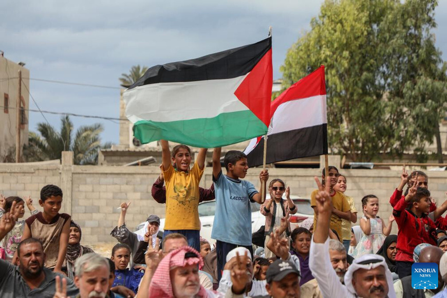 Palestinians celebrate following the announcement that Israel and Hamas have agreed to a Gaza ceasefire deal in front of the headquarters of the Egyptian committee in Deir al-Balah, central Gaza Strip, on Oct. 9, 2025. Israel and Hamas on Thursday agreed to a Gaza ceasefire deal, offering a tentative path toward ending the two-year conflict that has killed over 67,000 Palestinians, injured almost 170,000 others, and left the enclave in ruins. (Photo by Rizek Abdeljawad/Xinhua)