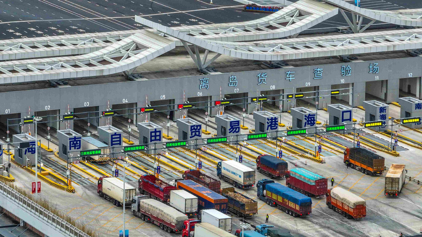 China launched island-wide special customs operation at the Hainan Free Trade Port (FTP) on Dec. 18, 2025. Photo shows trucks passing an inspection yard of a "second-line port" in Haikou, capital of Hainan province. (Photo/Zhang Mao)
