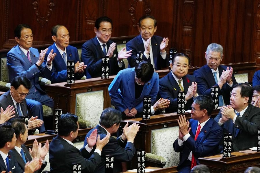 Sanae Takaichi (C) bows after winning the prime ministerial designation vote in the House of Representatives in Tokyo, Japan, Oct. 21, 2025. (Xinhua/Jia Haocheng)