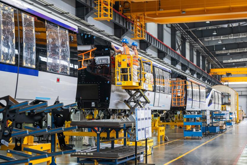 Unmanned rail transit cars are manufactured in a workshop of CRRC Puzhen Alstom Transportation System Limited in Wuhu, east China's Anhui province. (Photo/Xiao Benxiang)
