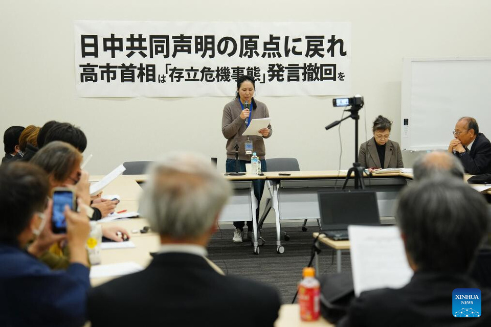 An anchorperson reads out a joint appeal calling for Prime Minister Sanae Takaichi to retract her statements, return to the starting point of the normalization of Japan-China relations, and promote the development of friendly relations between Japan and China, during a gathering in Tokyo, Japan, Dec. 2, 2025. Several Japanese lawmakers and prominent scholars gathered Tuesday evening at the Members' Office Building of the House of Councillors to urge Prime Minister Sanae Takaichi to retract her recent erroneous remarks on Taiwan. (Xinhua/Jia Haocheng)