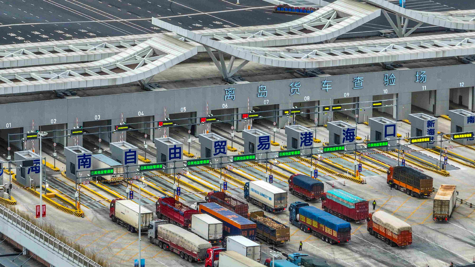 China launched island-wide special customs operation at the Hainan Free Trade Port (FTP) on Dec. 18, 2025. Photo shows trucks passing an inspection yard of a "second-line port" in Haikou, capital of Hainan province. (Photo/Zhang Mao)