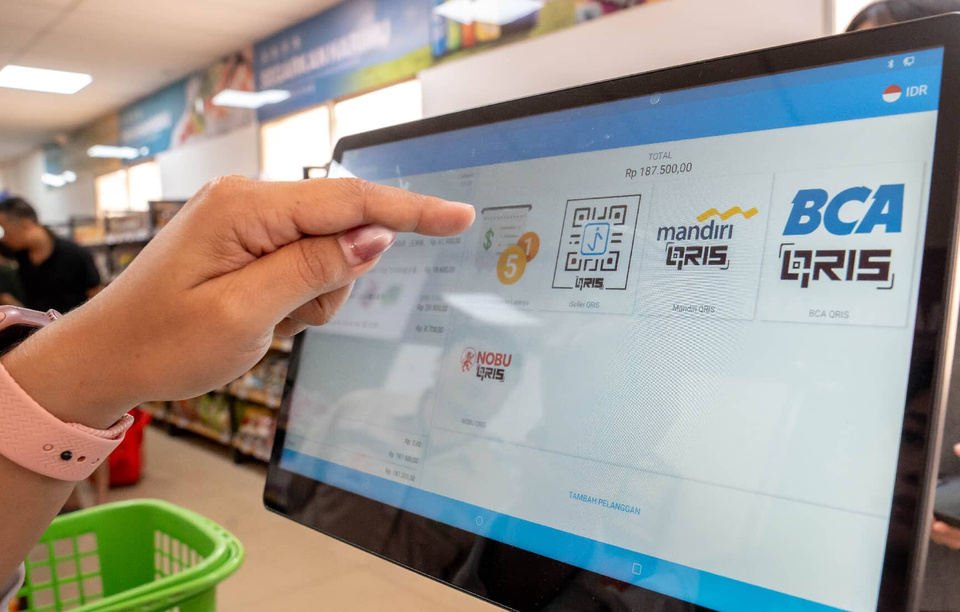 Chinese mobile payment platforms Alipay and UnionPay are available at a supermarket in the Indonesia Morowali Industrial Park. (Photo/Fan Jiageng)