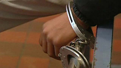 Homme menotté (PHOTO: DR)